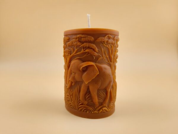 Close-up of the Elephant Pillar candle from The Angelina Store – a handcrafted caramel pillar candle featuring a detailed elephant and sacred tree design, infused with rich Nag Champa fragrance.